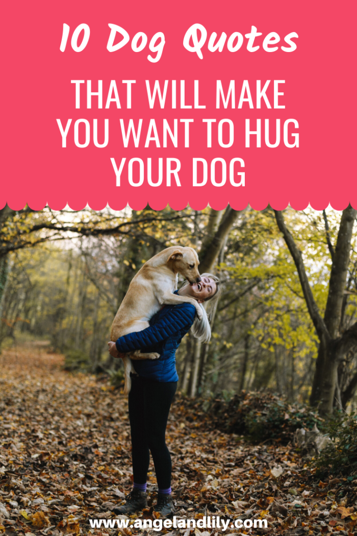 woman hugging yellow lab in the forest