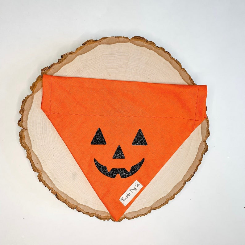 Orange and black jack-o-lantern dog bandana